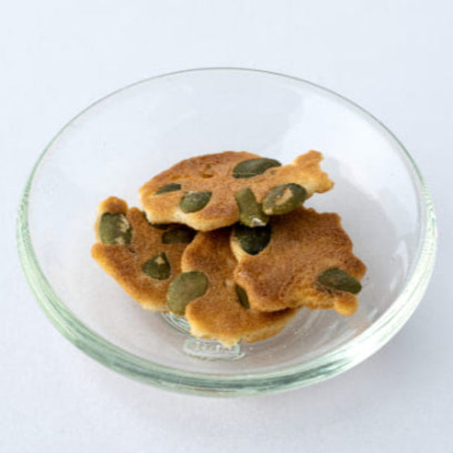 Rice flour and pumpkin seed bite-sized crackers